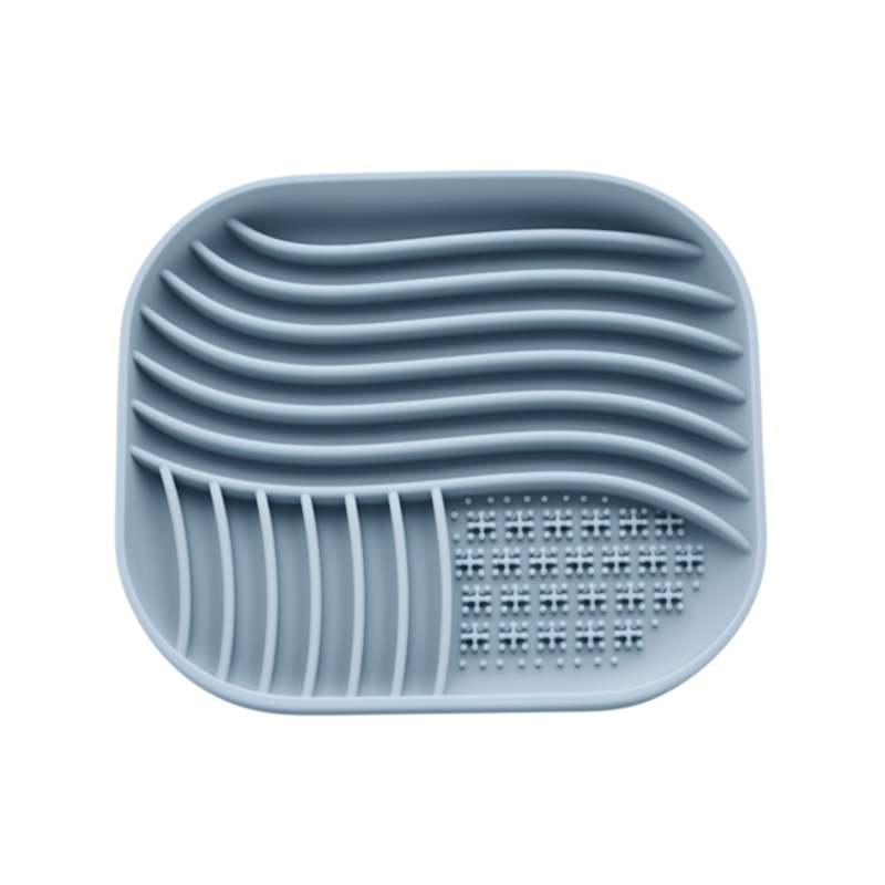 Blue silicone dish drainer with grid design on a white background