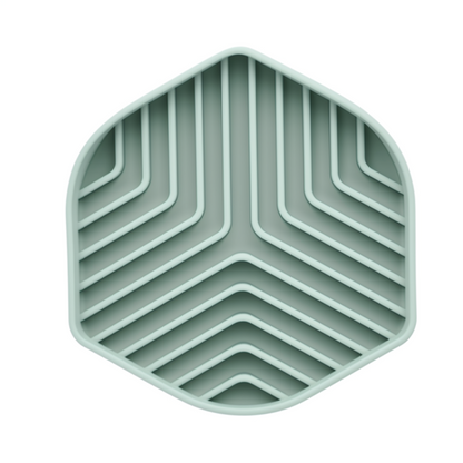 Hexagonal green tray with zigzag pattern on a white background