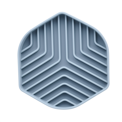 Hexagonal silicone mat with zigzag pattern on a white background