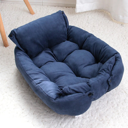 Blue pet bed on a white carpet