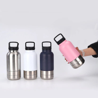 Set of four insulated water bottles with different colors on a white background
