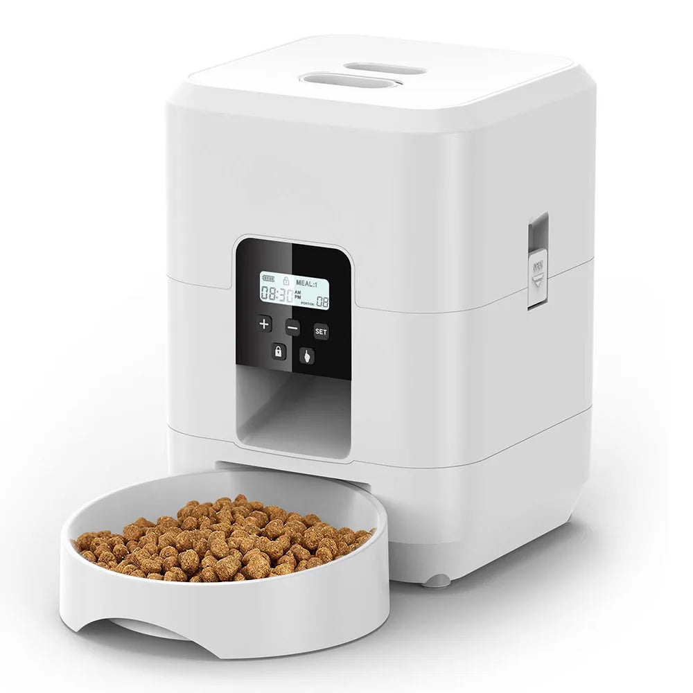 White automatic pet feeder with a bowl of kibble on a white background