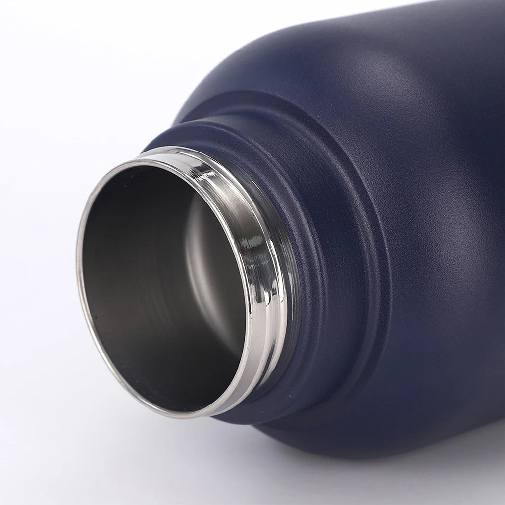 Close-up of a blue insulated bottle with a silver rim on a white background